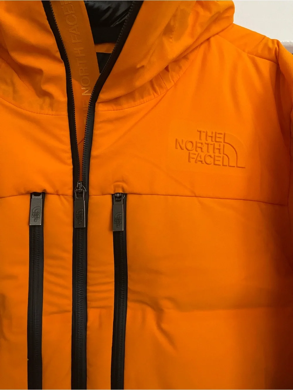 The North Face Men’s Orange and Black Hooded Puffer Jacket